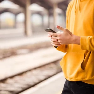 close-up-stylish-man-railway-station_23-2148357300